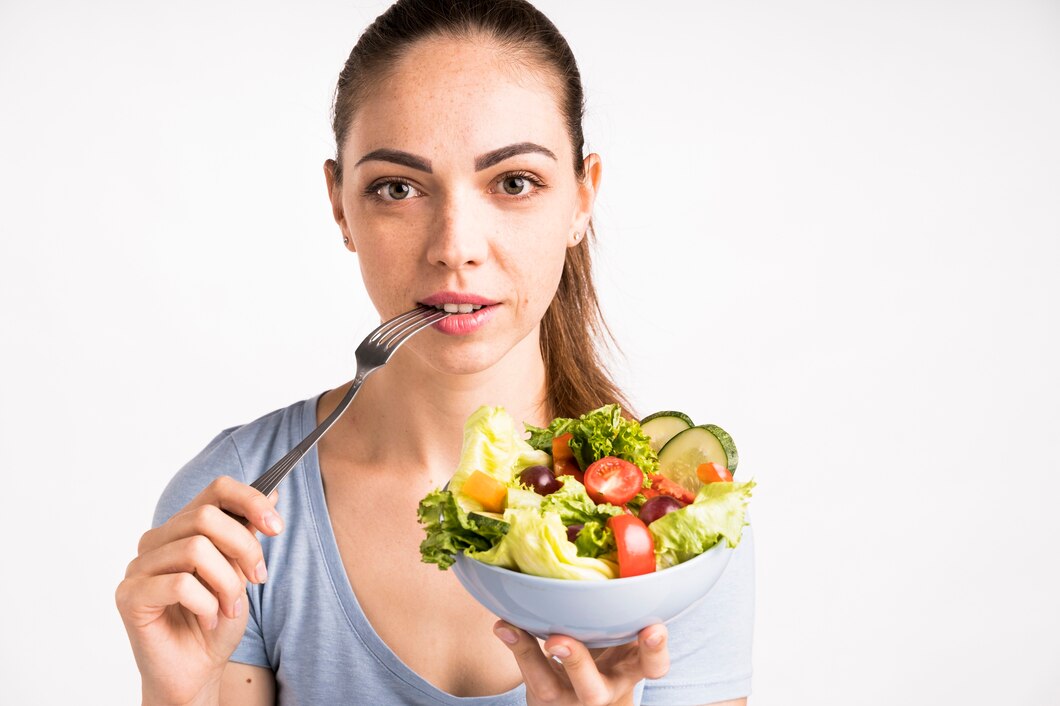 close-up-portrait-woman-holding-salad_23-2148256140