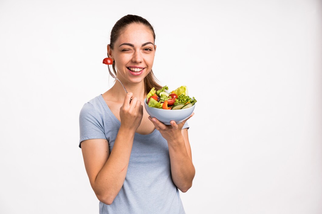 woman-smiling-holding-salad_23-2148256141